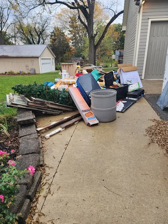 Dumpster being loaded with debris for 3 Yard Dumpster Rental in Colebrookdale